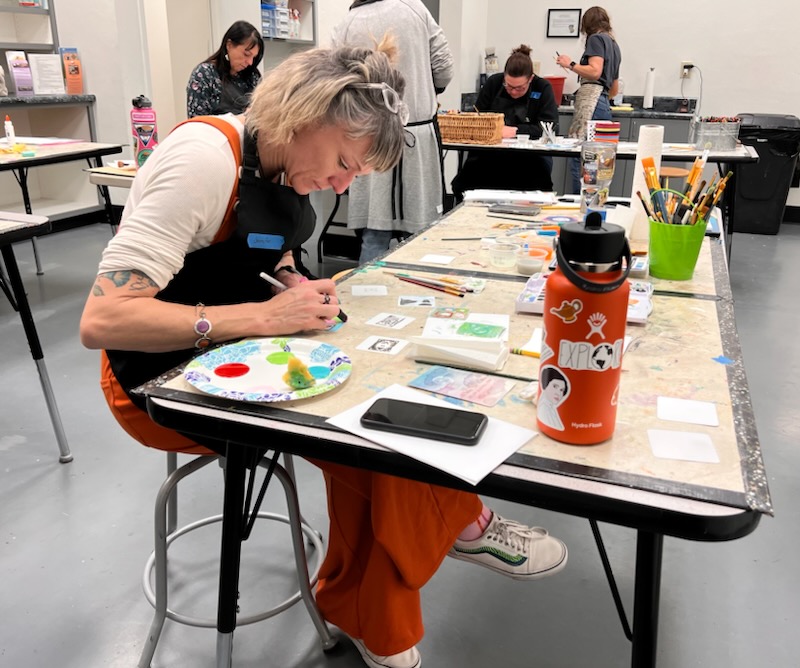 Photo of participants making art in art journey class.